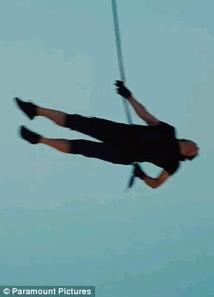 No fear: Cruise launches himself off the 2,717 ft high building