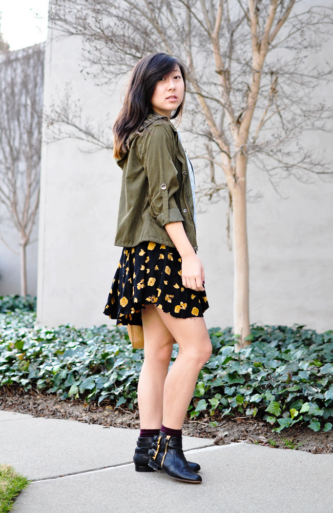 A California-based personal style blog: ModCloth black crop top, vintage printed skirt, H&M denim vest, Brandy Melville army green jacket, maroon H&M ankle socks, Dolce Vita black booties, vintage tan Coach satchel, black braided Levis belt