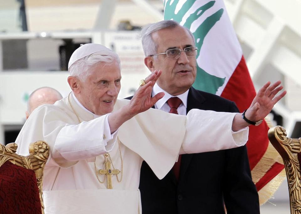 Pope Benedict XVI stood next to Lebanese President Michel Suleiman as he waved to the crowd at Rafik Hariri international airport, in Beirut, Lebanon, on Friday.