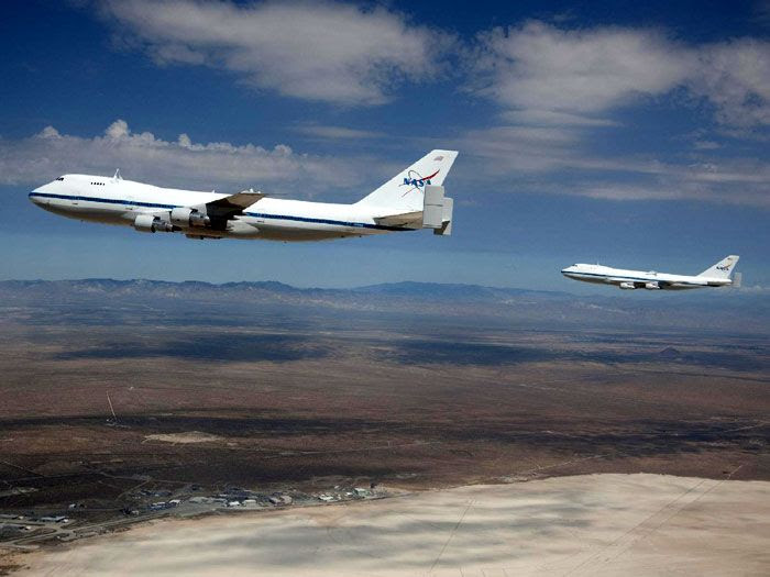 NASA's two Shuttle Carrier Aircraft fly above Edwards Air Force Base in California, on August 2, 2011.