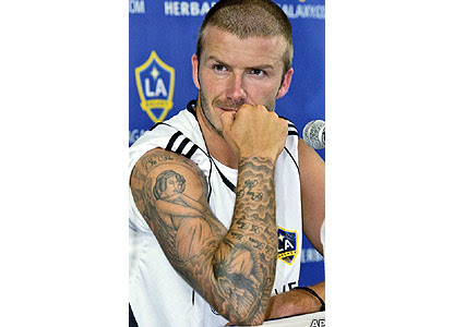 He also has Victoria's name in Hindi and the Roman numeral VII - the number 