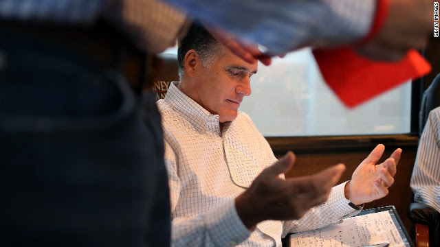 Romney talks with advisers on his campaign bus while en route to a rally at Avon Lake High School on Monday, October 29, in Avon Lake, Ohio.