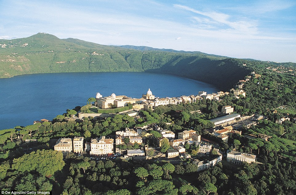 Stunning: Castel Gandolfo soars above the turquoise waters of Lake Albano, 12 miles south-east of Rome