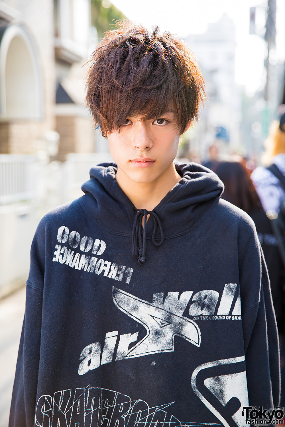 Harajuku Guy in Oversized Hoodie, Ripped Jeans, Sneakers 