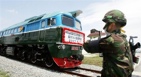 A North Korean train crosses the border line as a South Korean military north korean army training. A North Korean train crosses the border line as a South Korean military