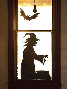 Decorate your windows with spooky silhouettes...just cut out some cool shapes from black cardboard, apply them on windows and turn on the lights.