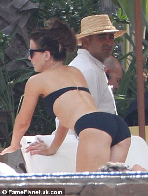 Hard at work: The actress also has action films like Total Recall and Underworld to thank for her fit figure