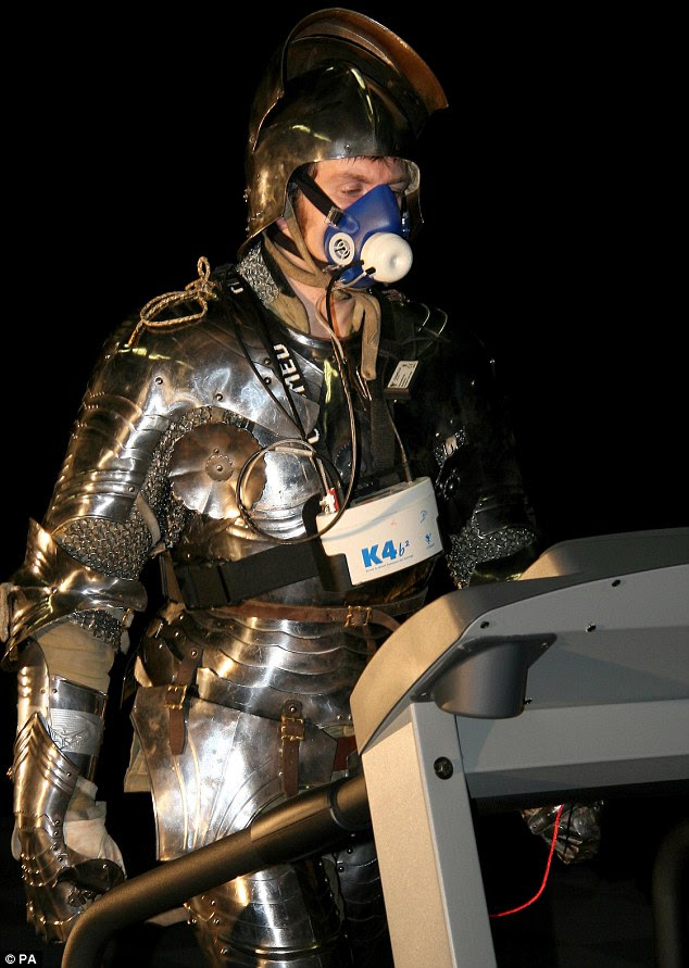Old meets new: A volunteer in French Medieval armour walks on a running machine. Historians now believe the French lost the Battle Of Agincourt because their heavy armour left them too exhausted to fight