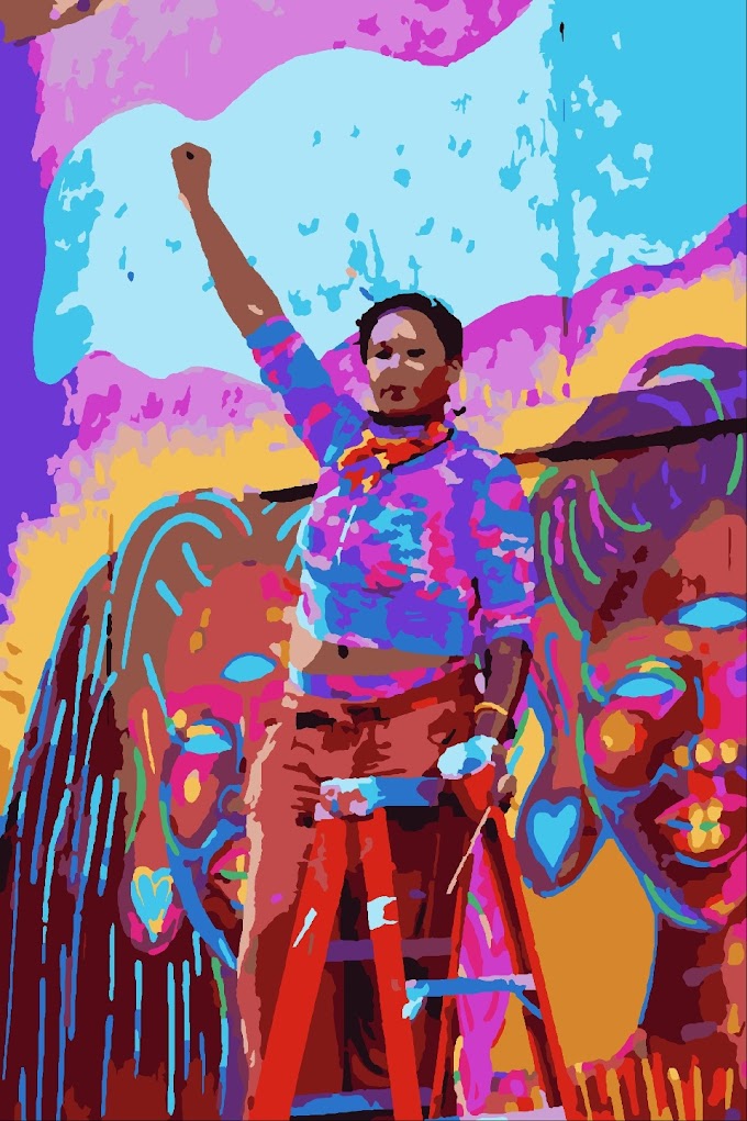 woman standing beside graffiti wall