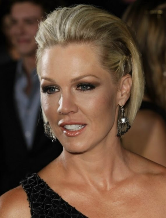 Jennie Garth wearing her short hair with the sides braided close to her
