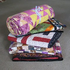 finished pile of quilts
