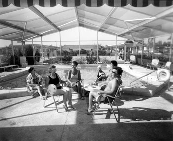 Ladies sit near the community swimming pool: Fort Lauderdale, Florida (1967)