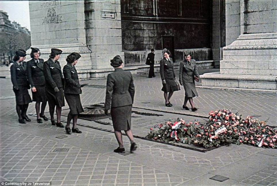 War to end all wars? Women in military uniforms look at a war memorial commemorating those killed in the First World War just over two decades earlier