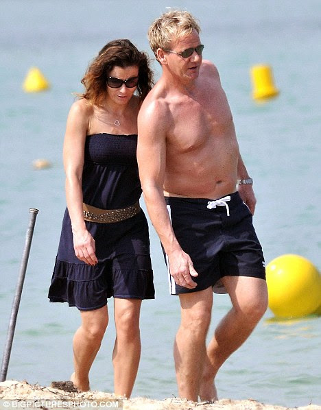 Time out: Gordon Ramsay and his wife Tana enjoy a walk on the  beach in St Tropez yesterday