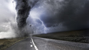 Powerful Tornado - destroying property with lightning in the background