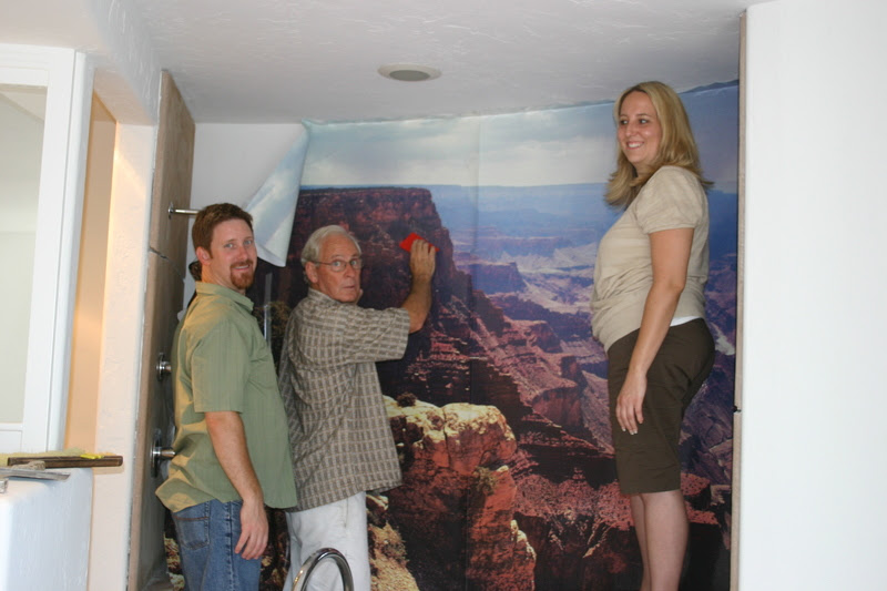 The family putting up the wall scene of James’ own photo!