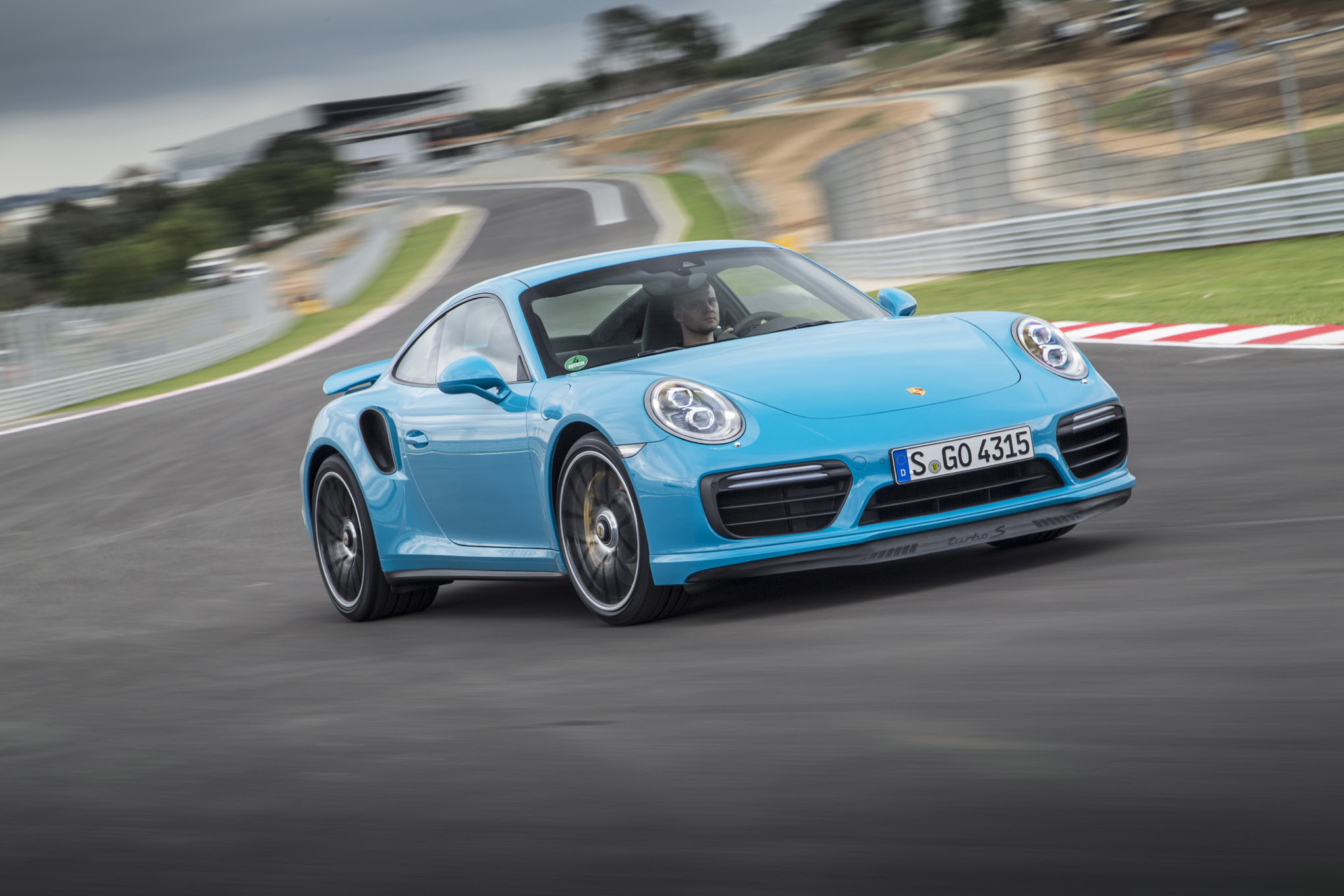 2017 Porsche 911 Turbo S front three quarter in motion 02 1