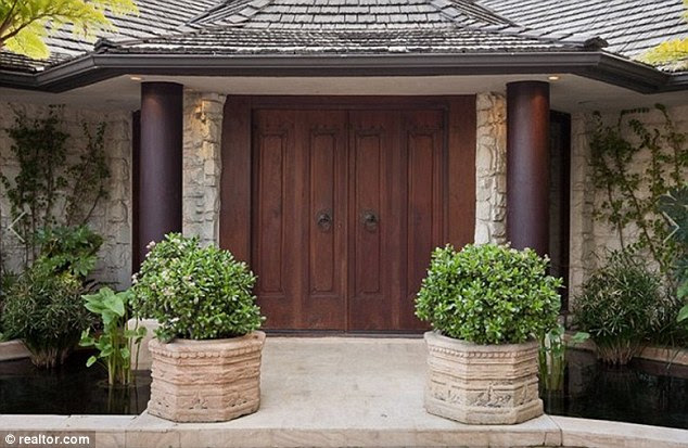 Step into the parlor: Double doors lead the way into more than 4,000 square feet of luxury