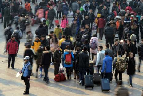 Keramaian saat 'mudik' di Beijing (Mark Ralston/AFP/Getty Images