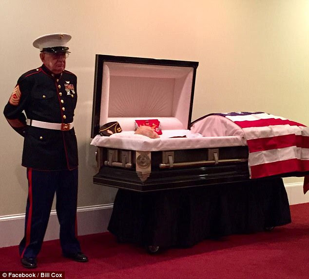 Honor: Retired Marine Master Sgt. William H. Cox (left) kept his promise to stand guard at his friend's funeral, Retired Marine First Sgt. James 'Hollie' Hollingsworth on October 24
