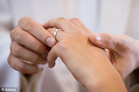 For richer for poorer: Married mother-of-four Alena Kurejova, 35, was paid £950 to wed Nigerian Oladotun Ogundari, 31, while her real husband was in Slovakia 