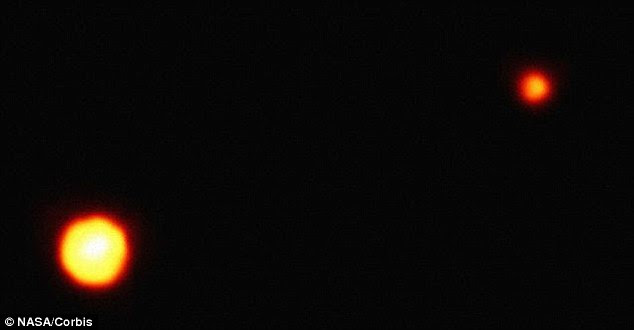 This is one of the clearest images obtained of Pluto and its moon Charon by the Hubble Space Telescope