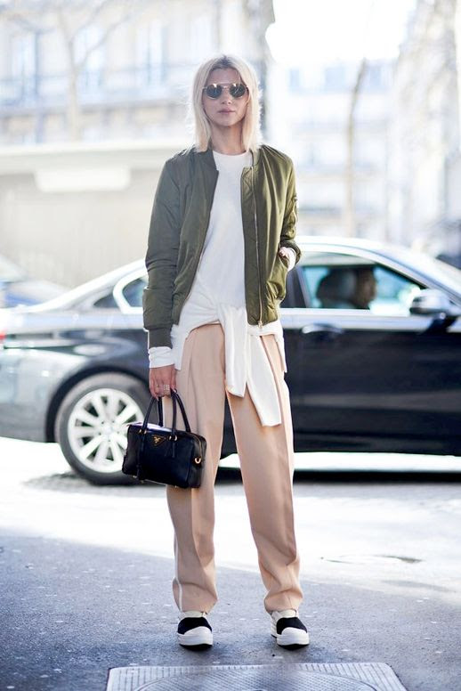 Le Fashion Blog Pfw Street Style Fresh Spring Color Combo Round Sunglasses Green Bomber Jacket White Tie Front Sweater Pink Trousers Black And White Chunky Sneakers Via Harpers Bazaar Australia