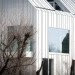 Blanco Oostduinkerke Residence, BURO II & ARCHI+I, Belgium, aluminum cladding, vernacular, pitched house, marionettes, dune grasses, coastal architecture, contemporary coastal architecture, daylighting, sustainable design, green design, sustainable materials, minimalist design