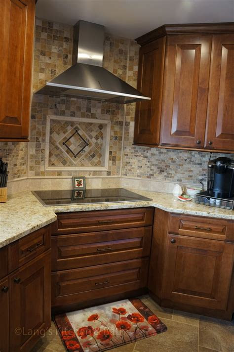 Pedestal sinks are simple and elegant choices for large and small bathrooms alike. At the center of this kitchen renovation is the corner