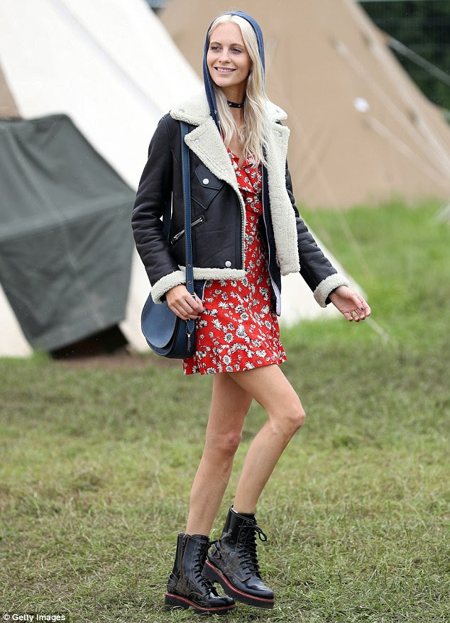 Poppy Delevingne wears a bright red floral mini dress as she ...