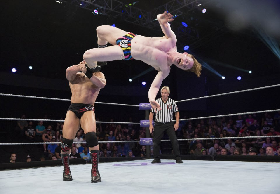 Ring technician Jack Gallagher hits a perfect dropkick