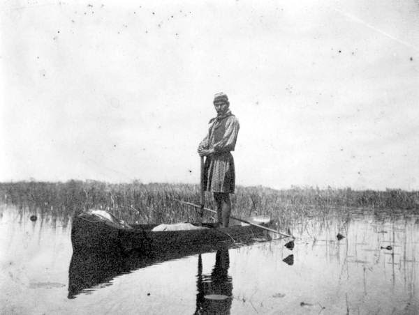  seminole indian building a dugout canoe at camp www floridamemory com