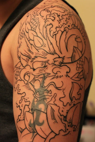 Chinese and Japanese Tribal Dragon Tattoos