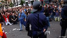 Protesters shout slogans as a riot policeman hides his nightstick during the demonstration at the parliament against austerity measures announced by the Spanish government in Madrid, Spain, Tuesday, Sept. 25, 2012. 
Photo:Andres Kudacki/AP/dapd
