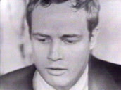 Marlon Brando plays bongos in basement of his home, Los Angeles; 01 Apr 55