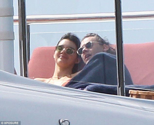 Getting cosy: After many moments of cuddles and play fights, some fans are questioning the state of Kendall and Harry's romance and if they have gone from platonic to romantic after their rumoured 2013 romance