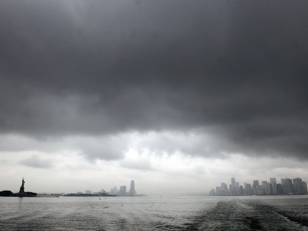 New York skyline is enveloped in the dark clouds as Hurricane Irene approaches