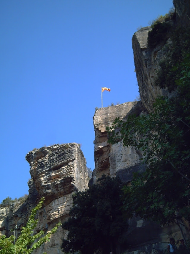 Sant Miquel Del Fai Cliffs and Catalan Flag