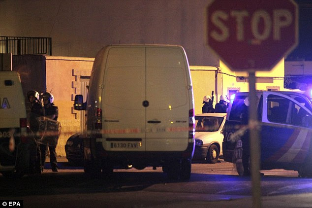 Police operation: Vehicles and personnel from the Spanish Police are seen outside an apartment at los Junquillos district in La Linea de la Concepcion, Cadiz, Southern Spain