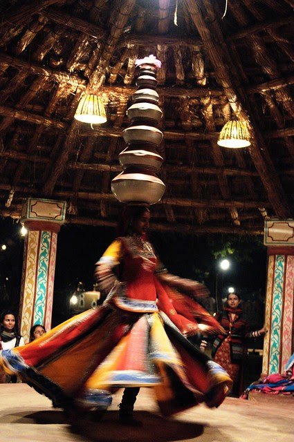 Folk dancer with pots on her head