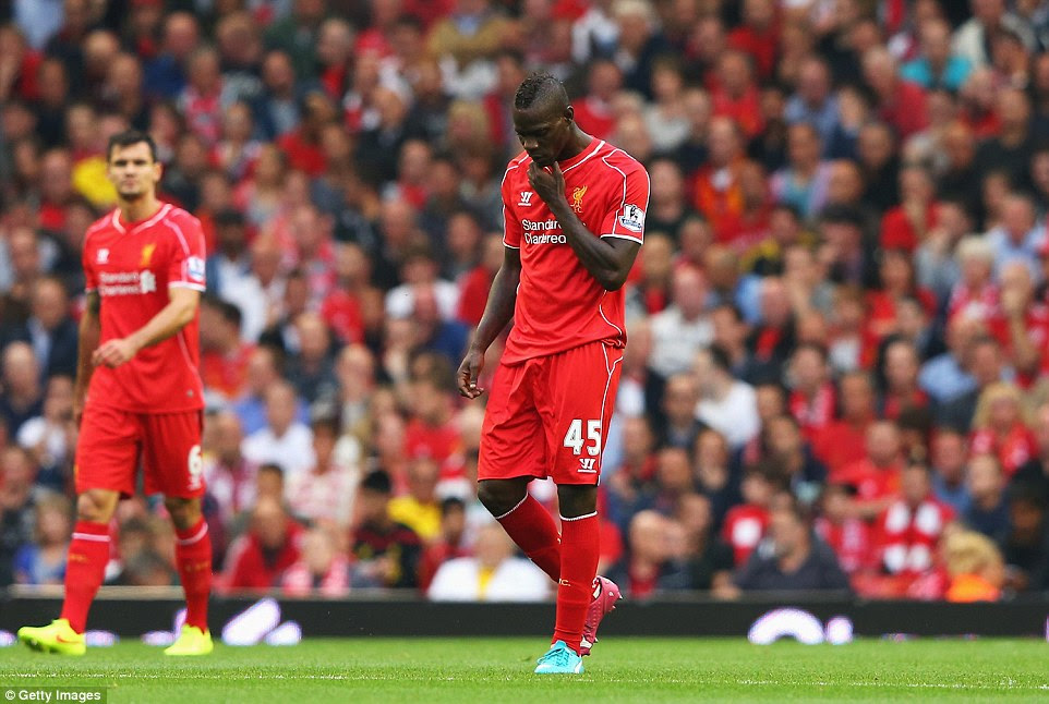 Mario Balotelli walks back to the centre after Aston Villa took a surprising early lead against Liverpool at Anfield in the Saturday evening Premier League match