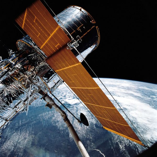 The Hubble Space Telescope is about to be deployed from the orbiter Discovery during shuttle flight STS-31, on April 25, 1990.