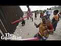 The pink seesaws of harmony reach across the divide at US-Mexico border