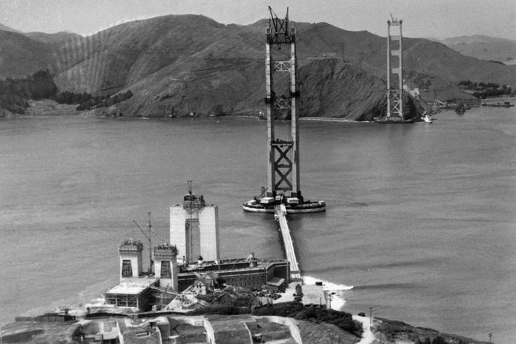 Description of . The construction of the Golden Gate Bridge, which would link Fort Point, bottom, with Marin County, Calif., top, is seen as work progressed, 1934.  (AP Photo/Redwood Empire Association)