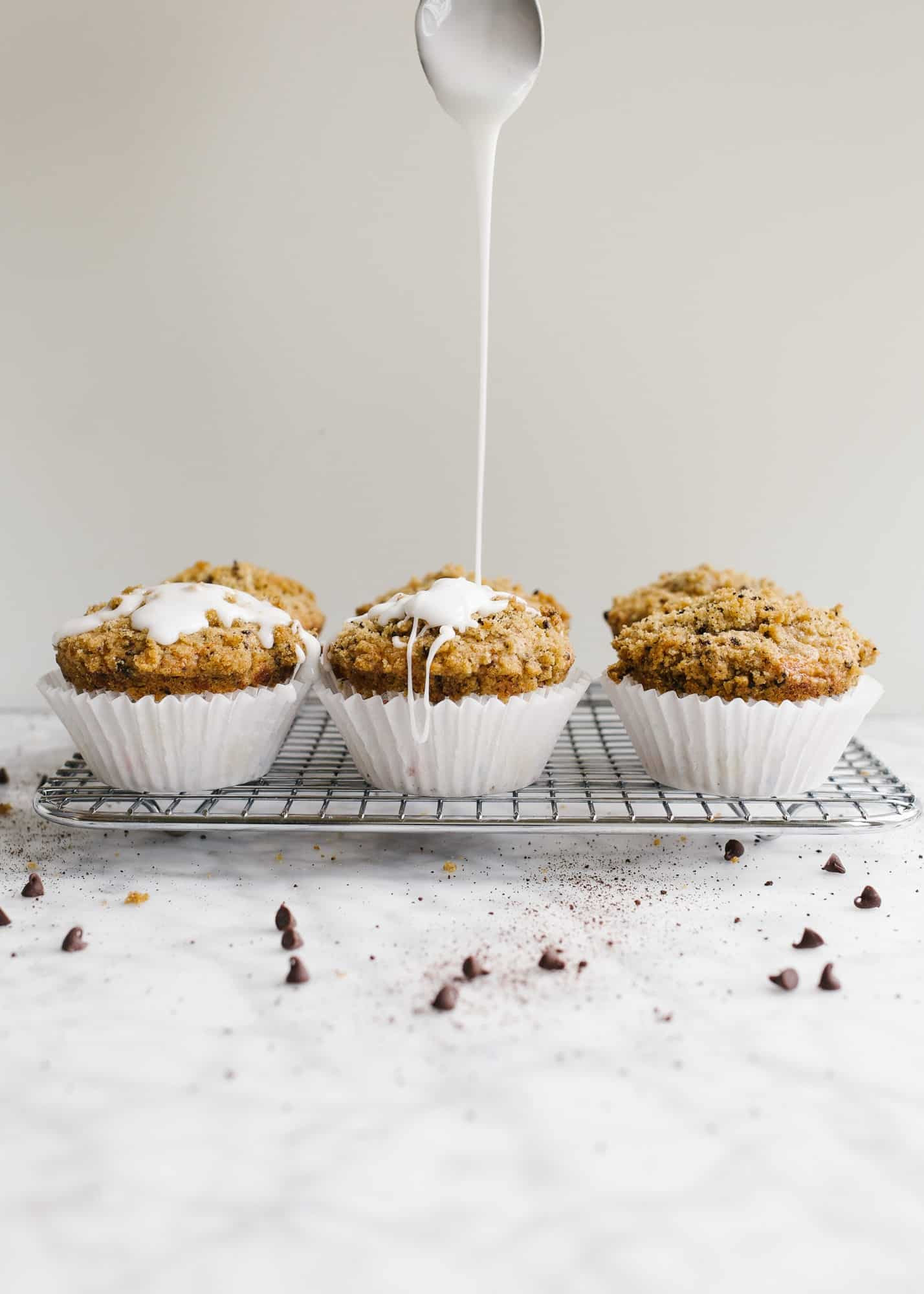 Java Chip Muffins by Wood and Spoon blog. These are fluffy, one-bowl muffins scented with coffee and dotted with mini chocolate chips. The muffins have a simple brown sugar streusel crumble that has espresso powder and adds a bit of sweet to the muffins. These taste terrific with morning coffee and are a simple make ahead breakfast or brunch treat. Learn more about this easy family recipe on thewoodandspoon.com