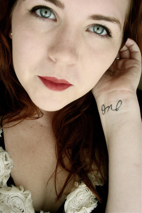 female with tattoos