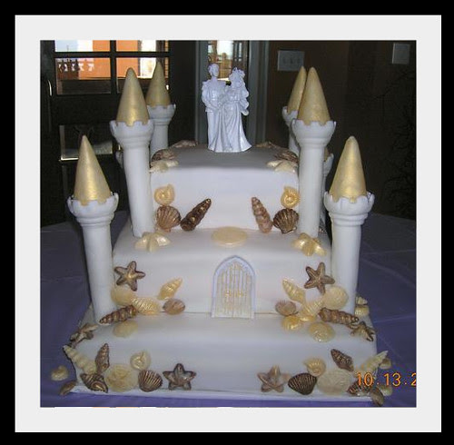castle wedding cake with chocolate shells by savorysweetscakery