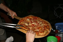 serving pizza