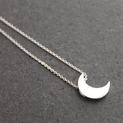 Here are tips on how to keep your sterling silver jewelry from tarnishing. silver moon pendant necklace by attic | notonthehighstreet.com