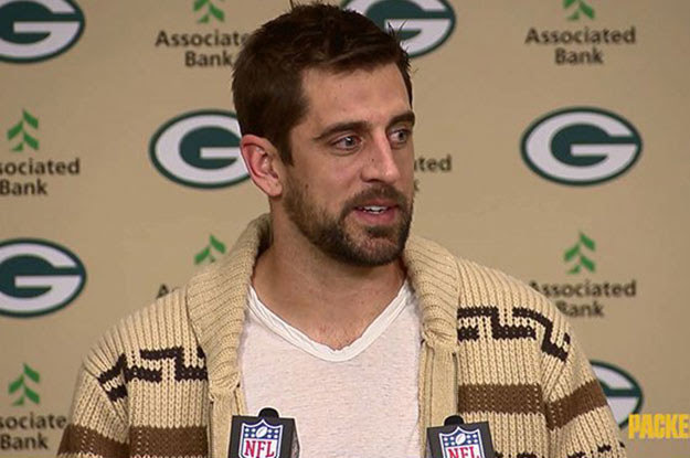 Packers quarterback Aaron Rodgers showed up to last night's post-game press conference in a sweater than looks suspiciously like another famous cardigan.